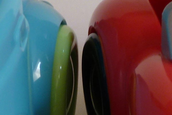 Close-up of colorful ceramic cups edges.
