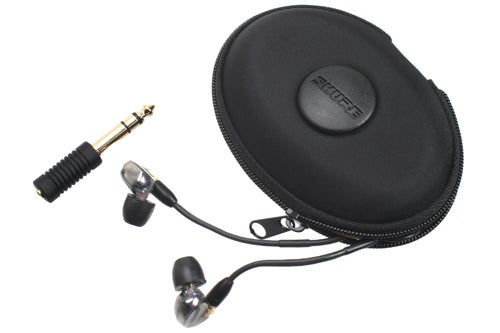 Shure SE425 earphones with carrying case and audio jack adapter.