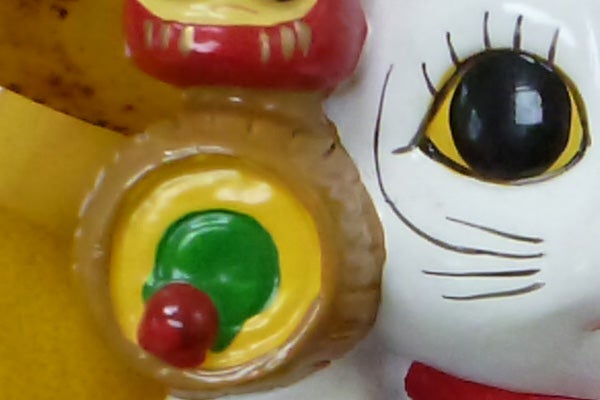 Colorful tart and Hello Kitty figurine close-up.