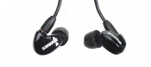 Shure SE315 earphones isolated on white background.