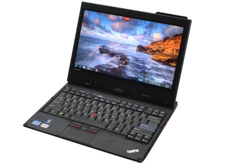 Lenovo ThinkPad X220 Tablet with screen displaying wallpaper