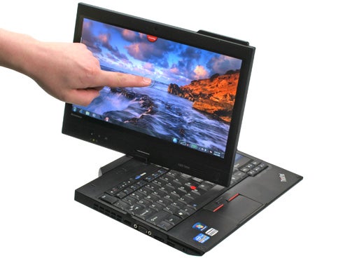 Finger pointing to Lenovo ThinkPad X220 Tablet screen.
