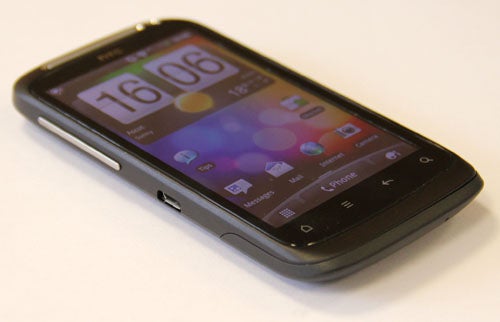 HTC Desire S smartphone on a white surface.