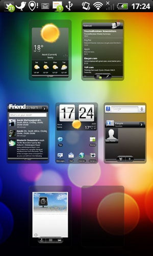 HTC Desire S smartphone displaying colorful home screen interface.