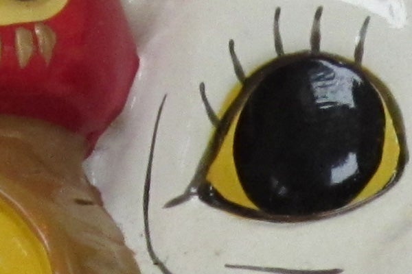 Close-up of a toy's eye with detailed painting