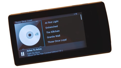 Cowon J3 MP3 player displaying music album tracklist.