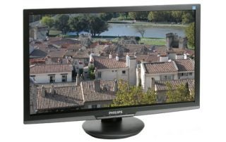 Philips E-Line 273E3 monitor displaying a cityscape image.