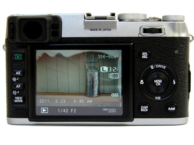 Fujifilm Finepix X100 camera displaying settings on LCD screen.