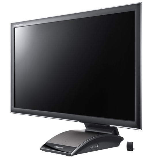 Samsung SyncMaster C27A750X monitor with stand and wireless hub.