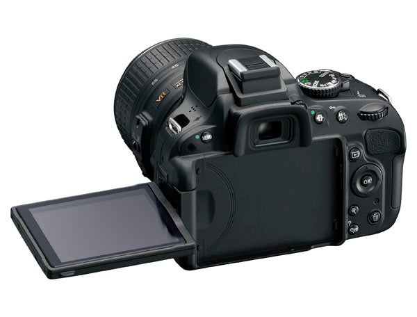 Nikon D5100 DSLR camera with articulated LCD screen.