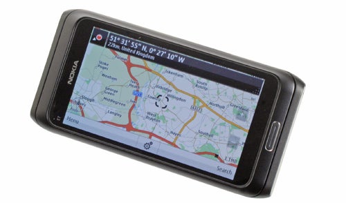 Nokia E7 smartphone displaying a GPS map on screen.