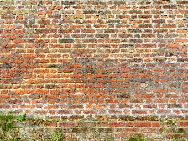 Old brick wall texture with varying shades of red and orange.