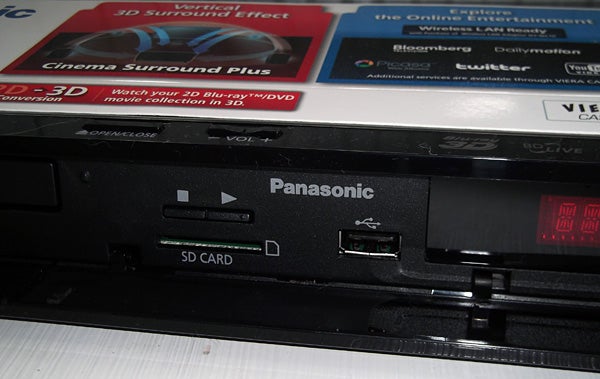 Close-up of Panasonic SC-BTT270 home theater system's SD card slot.