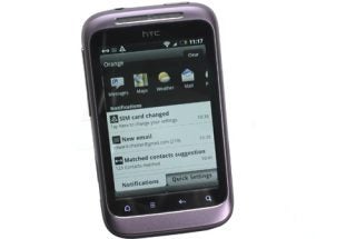 HTC Wildfire S smartphone displaying notifications on screen.