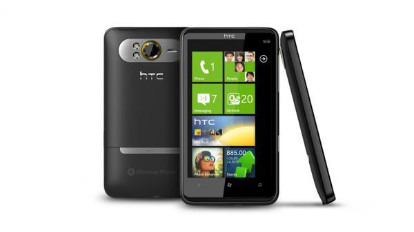 HTC HD7 smartphone with screen display on and rear view.