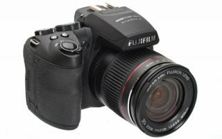 Fujifilm HS20 EXR camera with lens on white background.
