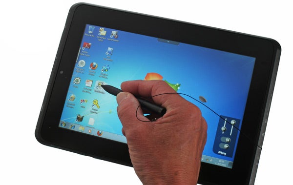 Hand using stylus on Fujitsu Q550 tablet screen.