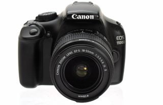 Canon EOS 1100D DSLR camera with 18-55mm lens.