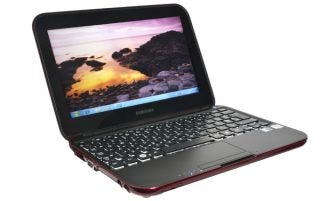 Samsung NS310 netbook with open lid displaying screen.