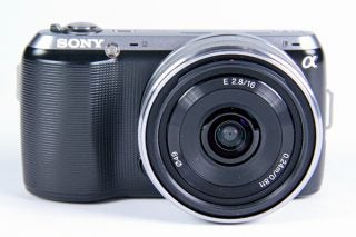Sony NEX-C3 camera with 16mm lens on white background.