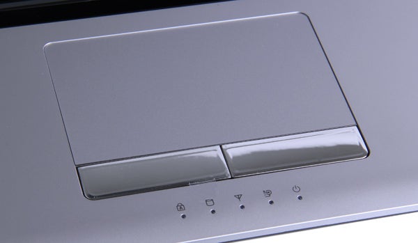 Close-up of Samsung RV720 laptop's touchpad and status indicators.