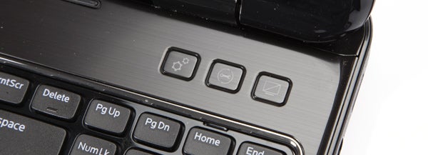 Close-up view of Dell Inspiron 15R laptop keyboard and power button.