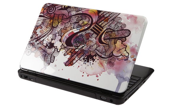 Dell Inspiron 15R laptop with artistic patterned cover design.