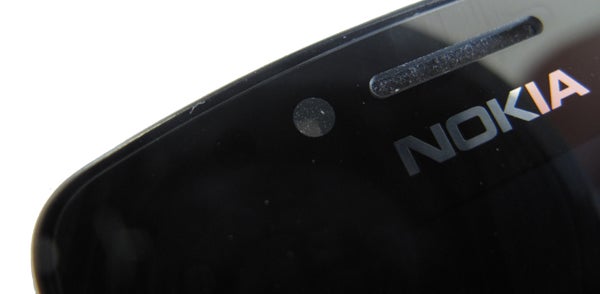 Light sensorClose-up of Nokia 700 phone frontal camera and logo.