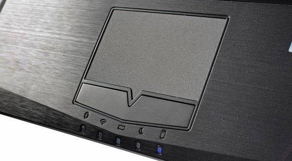 Close-up of Medion Erazer X6813 laptop touchpad and LED indicators.