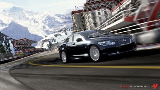Black car racing on a snowy mountain track in Forza Motorsport 4.