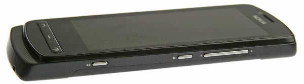 Nokia 700 6Nokia 700 smartphone lying on a flat surface.
