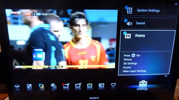 Sony KDL-40NX723Sony KDL-40NX723 TV displaying on-screen menu and football match.