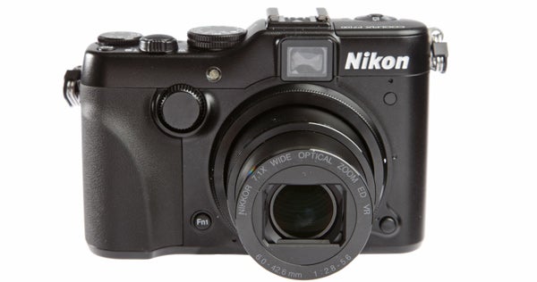 Nikon P7100 camera front view on white background.