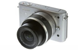 Nikon J1 camera with standard zoom lens displayed.
