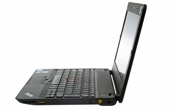 Lenovo ThinkPad X121e laptop with open screen displaying wallpaper.Lenovo ThinkPad X121e laptop with open lid on white background.