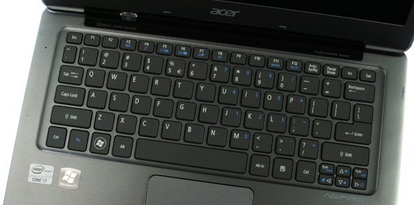 Close-up of Acer Aspire S3 laptop's touchpad.Acer Aspire S3 laptop keyboard and partial display.