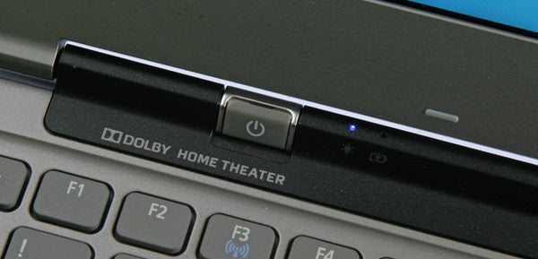 Close-up of Acer Aspire S3 laptop's power button and keyboardAcer Aspire S3 Ultrabook open with screen displaying wallpaper.