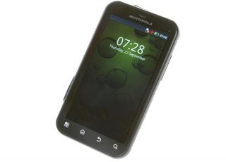 Motorola Defy+ smartphone on white background.