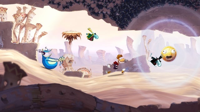 Rayman Origins gameplay scene with characters in desert level.