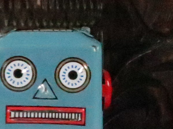 Close-up of a vintage toy robot face.