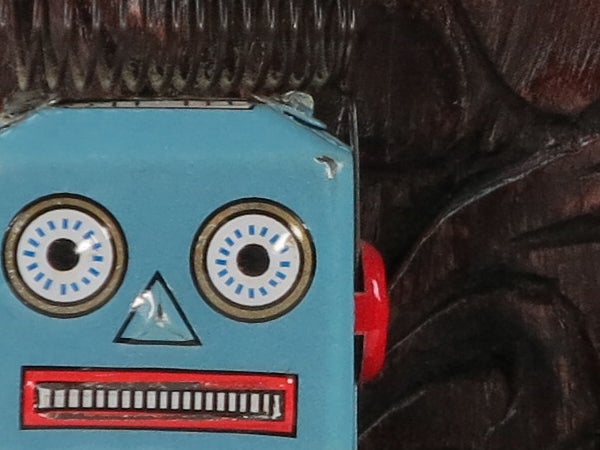 Close-up of a vintage blue toy robot face.