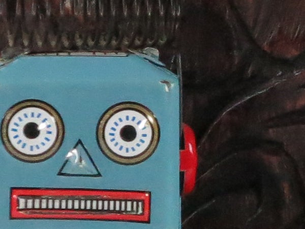 Close-up of a vintage toy robot's face.