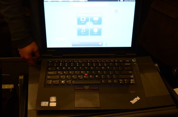 Lenovo ThinkPad X1 Hybrid laptop on display with screen visible.