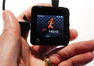 Motorola Motoactv fitness tracker showing workout duration on screen.