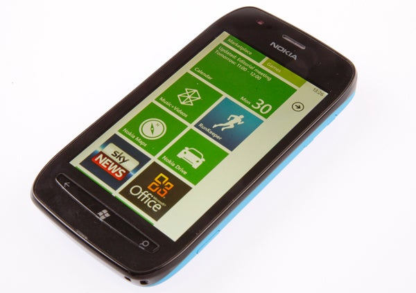 Nokia Lumia 710 smartphone with Windows interface displayed.Nokia Lumia 710 smartphone in blue, rear view on white background.