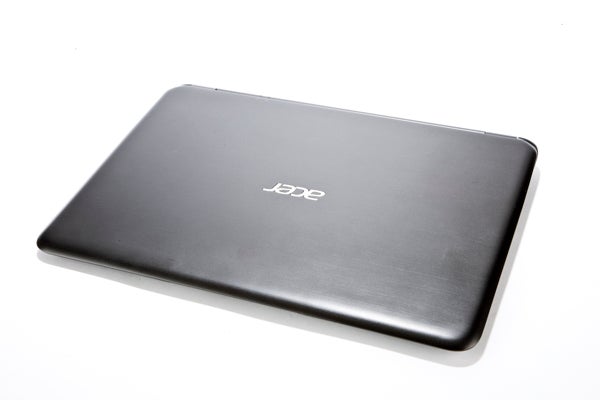 Acer Aspire S5 laptop closed lid on white background.