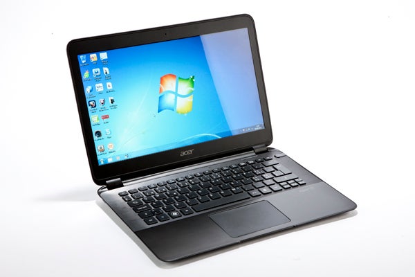 Acer Aspire S5 laptop with Windows desktop screen displayed.