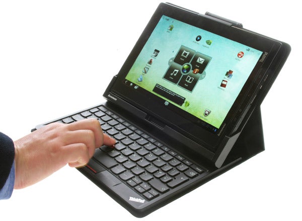 Side view of Lenovo ThinkPad Tablet showing ports and buttons.Person using stylus on Lenovo ThinkPad Tablet with keyboard behindLenovo ThinkPad Tablet with stylus pen inserted.Lenovo ThinkPad Tablet with keyboard stand in use.Lenovo ThinkPad Tablet with keyboard on white background.Lenovo ThinkPad Tablet with keyboard folio case.Lenovo ThinkPad Tablet with keyboard and person typing.Lenovo ThinkPad tablet with attached keyboard case.Lenovo ThinkPad Tablet with a black leather case.Lenovo ThinkPad Tablet stylus on white background.Lenovo ThinkPad Tablet stacked on a black folio case.Lenovo ThinkPad Tablet in laptop and tent modes.Lenovo ThinkPad Tablet in a protective black case.Close-up of a Lenovo ThinkPad tablet keyboard.