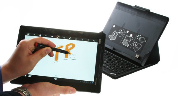 Person using stylus on Lenovo ThinkPad Tablet with keyboard dock