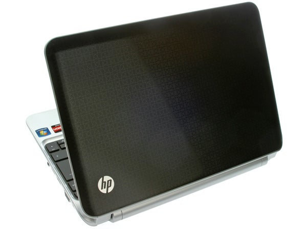 HP Pavilion dm1-3200sa laptop with open lid on white background.